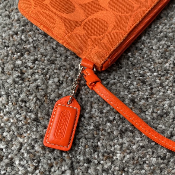 Orange Coach clutch. Like new. Other colors available. - Picture 3 of 3